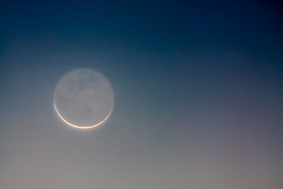 a soft moonlit sky